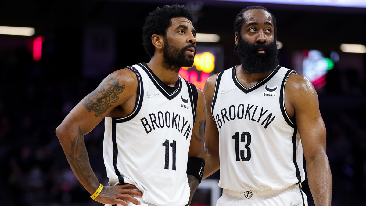 Brooklyn Nets guard Kyrie Irving (11) and guard James Harden (13) talk during the fourth quarter against the Sacramento Kings.