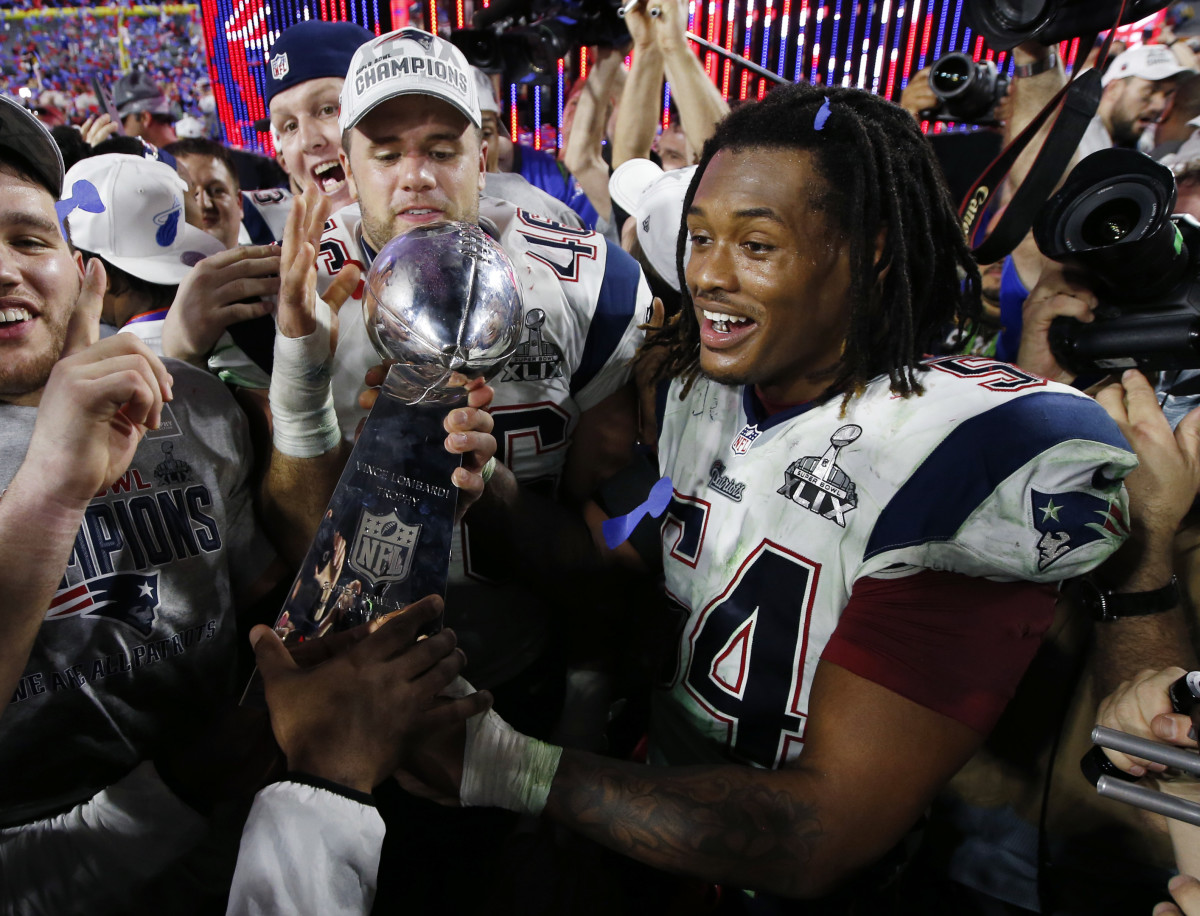 New England Patriots linebacker Dont'a Hightower celebrates with the Vince Lombardi Trophy after defeating the Seattle Seahawks in Super Bowl XLIX at University of Phoenix Stadium.