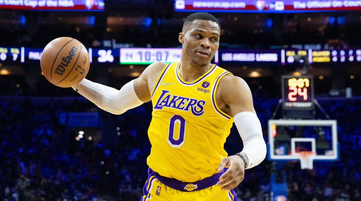 Lakers point guard Russell Westbrook dribbles the ball during a game.