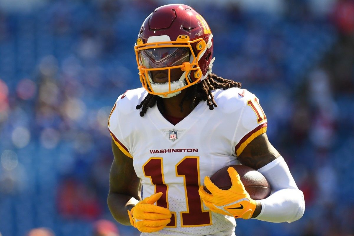 Washington Commanders WR Cam Sims warms up before game