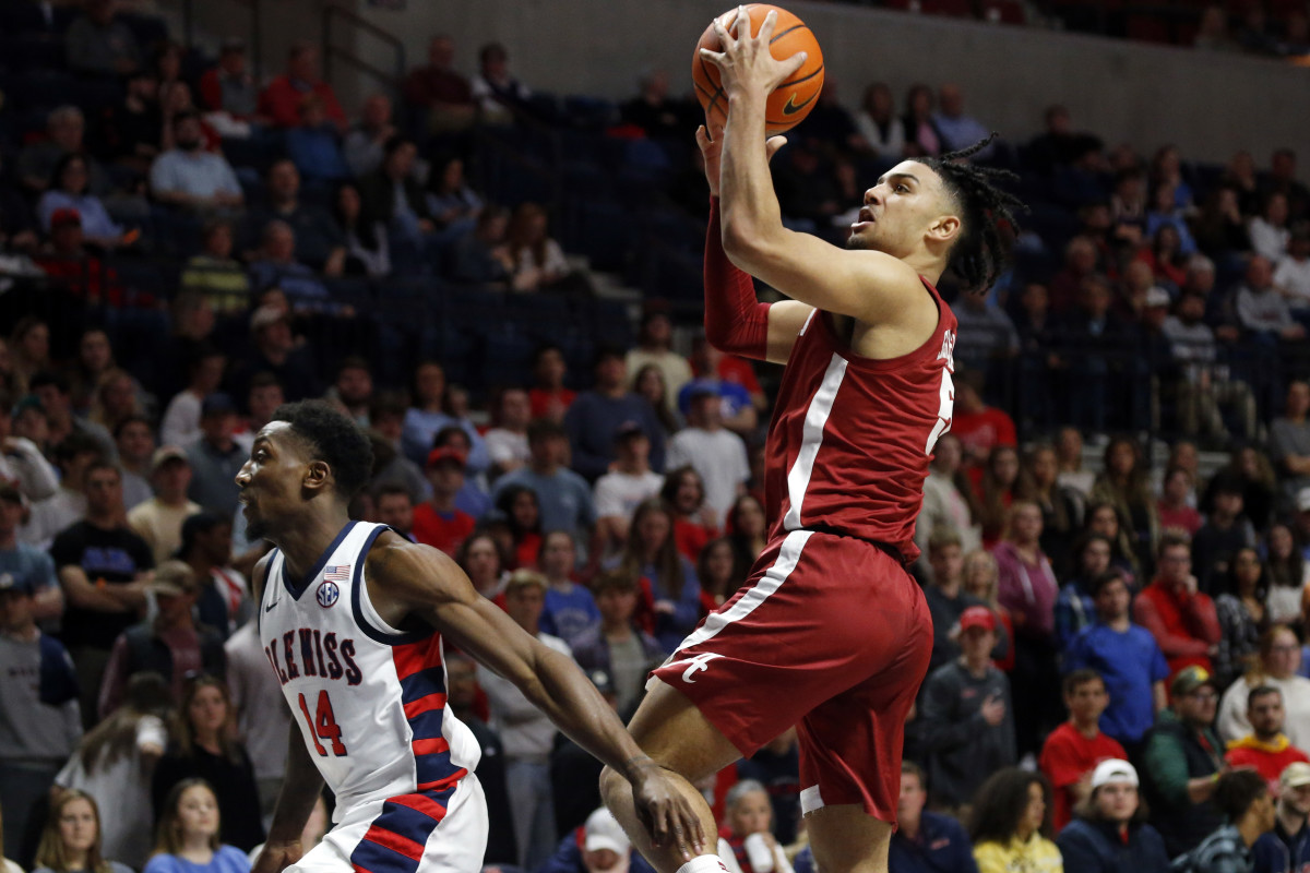 Alabama Crimson Tide guard Jaden Shackelford (5) drives to the basket as Mississippi Rebels guard Tye Fagan (14) defends during the first half at The Sandy and John Black Pavilion at Ole Miss.