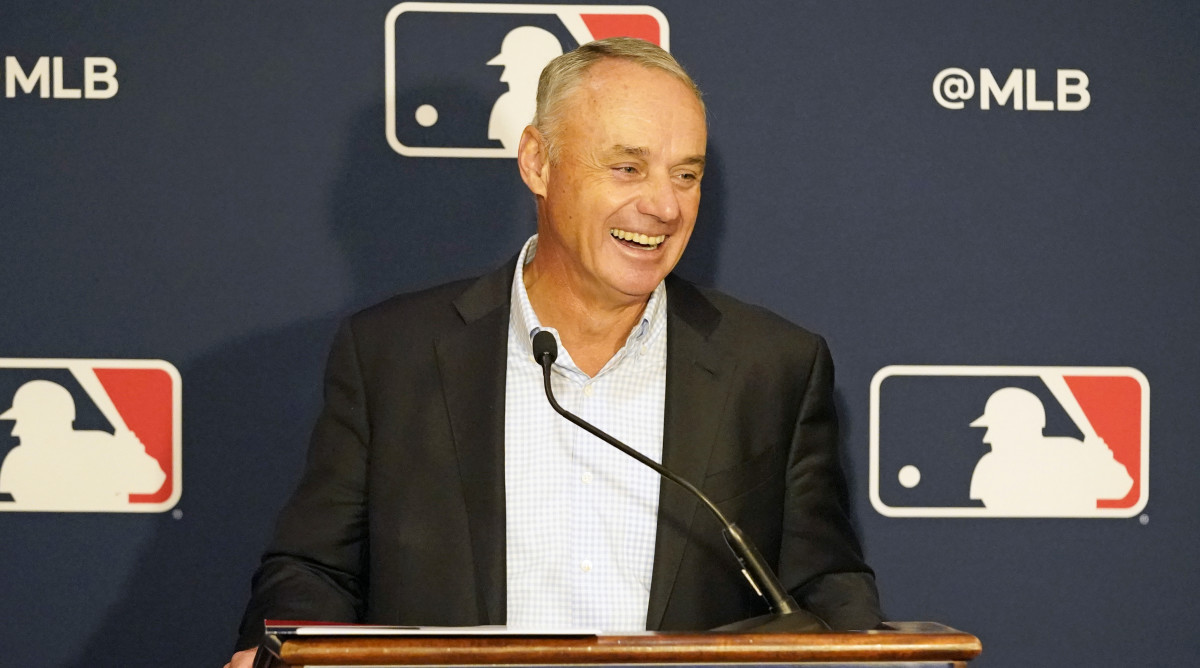 Major League Baseball commissioner Rob Manfred makes comments during a news conference at MLB baseball owners meetings, Thursday, Feb. 10, 2022, in Orlando, Fla. Manfred says spring training remains on hold because of a management lockout and his goal is to reach a labor contract that allows opening day as scheduled on March 31.