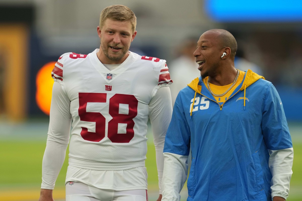 Dec 12, 2021; Inglewood, California, USA; New York Giants long snapper Casey Kreiter (58) talks with Los Angeles Chargers cornerback Chris Harris (25) during the game at SoFi Stadium.