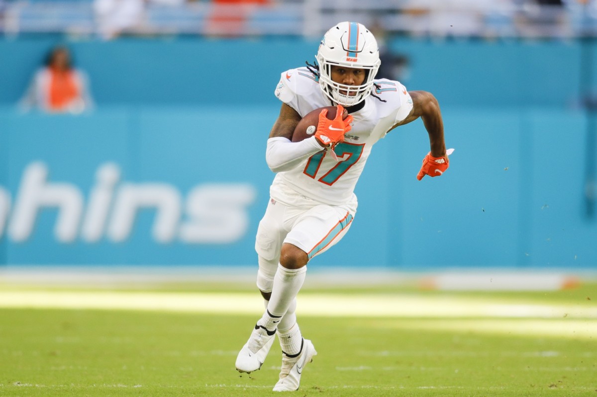 Miami Dolphins WR Jaylen Waddle runs after catch