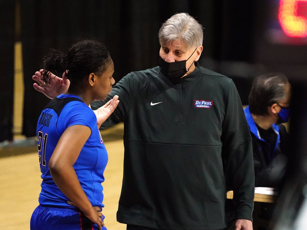 DePaul coach Doug Bruno talks to guard Darrione Rogers