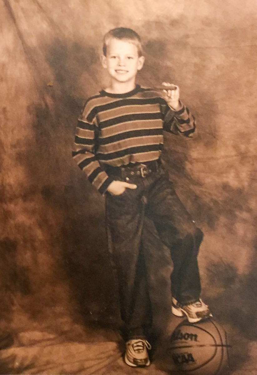 Joe Burrow, at age 7, continuing the family's cigar-posing tradition. 