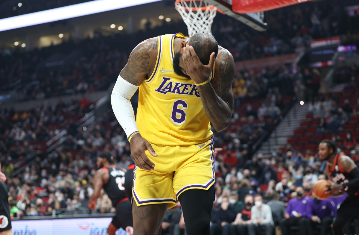 Feb 9, 2022; Portland, Oregon, USA; Los Angeles Lakers forward LeBron James (6) reacts after being hit in the head by Portland Trail Blazers forward Justise Winslow (26) in the first half at Moda Center. Mandatory Credit: Jaime Valdez-USA TODAY Sports