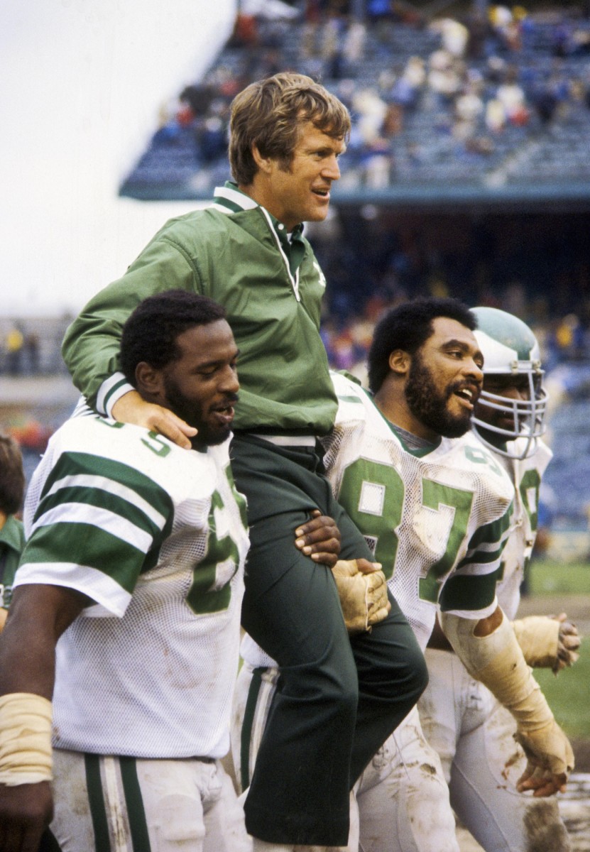 Dick Vermeil gets carried off the field by Claude Humphrey (left) and Charlie Johnson