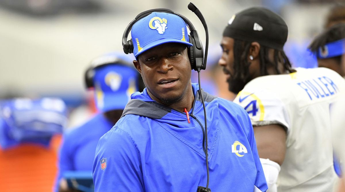 Los Angeles Rams defensive coordinator Raheem Morris talks on the sideline during the first half of an NFL football game against the Tampa Bay Buccaneers.