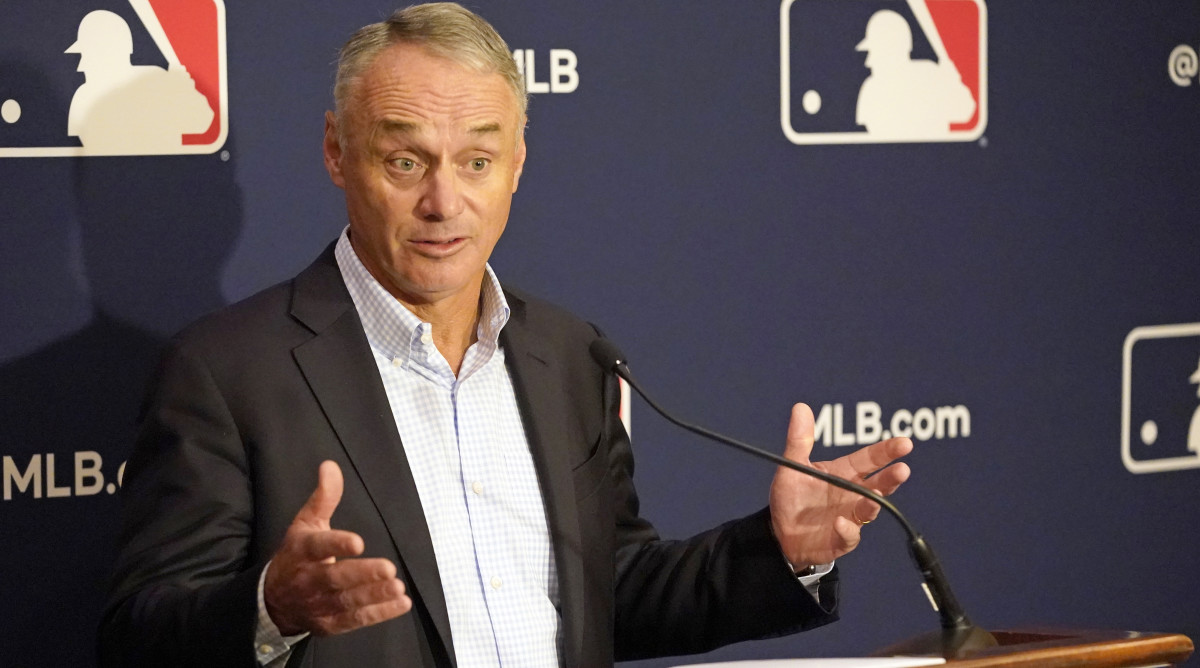 Major League Baseball commissioner Rob Manfred makes comments during a news conference at MLB baseball owners meetings, Thursday, Feb. 10, 2022, in Orlando, Fla. Manfred says spring training remains on hold because of a management lockout and his goal is to reach a labor contract that allows opening day as scheduled on March 31.