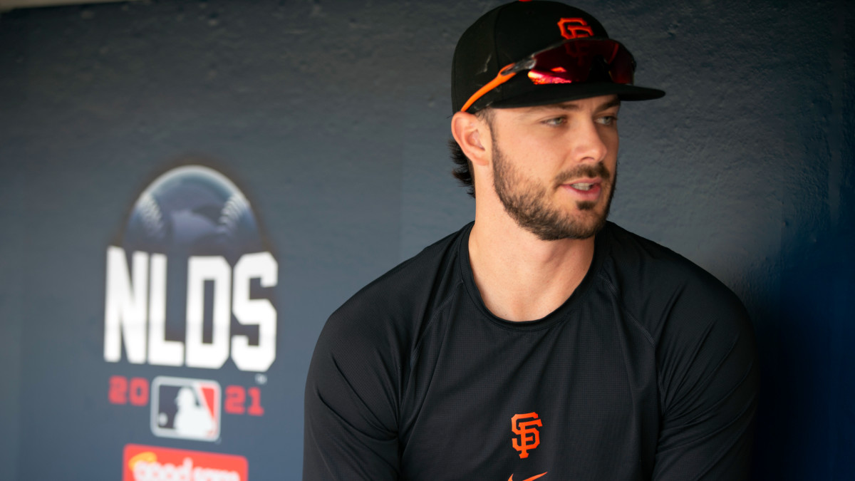 Oct 7, 2021; San Francisco, CA, USA; San Francisco Giants outfielder Kris Bryant (23) conducts an interview in the dugout during NLDS workouts. Mandatory Credit: D. Ross Cameron-USA TODAY Sports