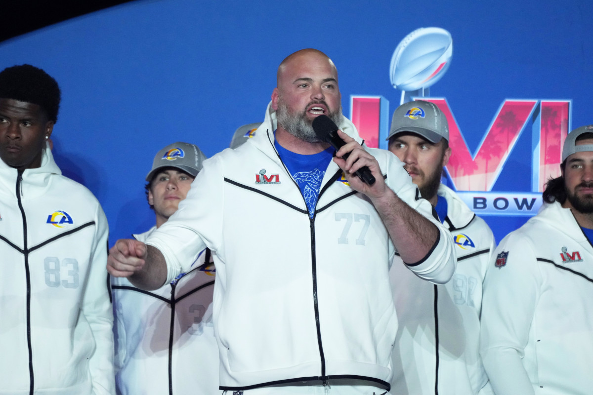 Feb 7, 2022; Westlake Village, CA, USA; Los Angeles Rams lineman Andrew Whitworth (77) speaks during Super Bowl LVI Opening Night at Oaks Christian High School. Mandatory Credit: Kirby Lee-USA TODAY Sports