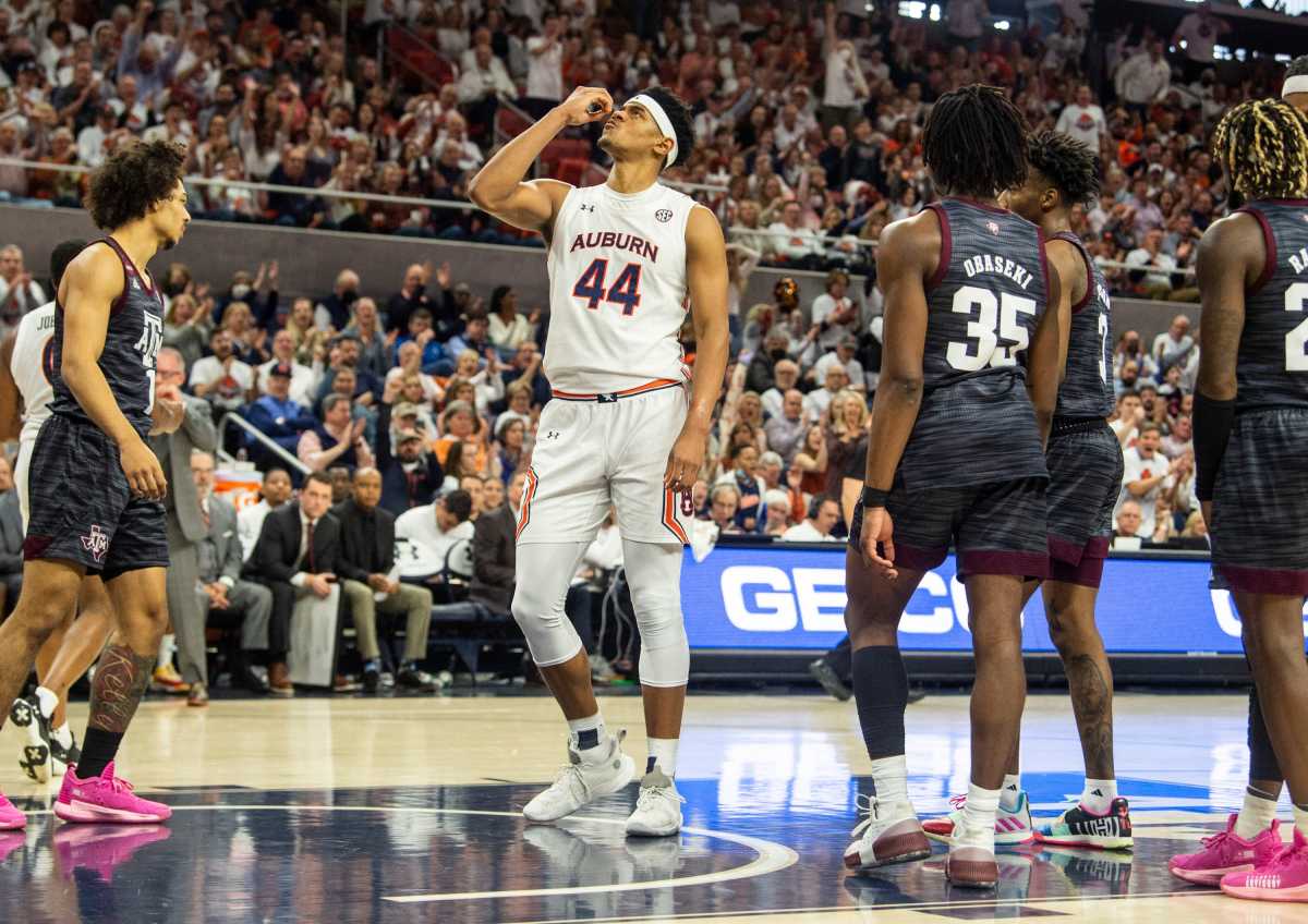 Auburn Tigers center Dylan Cardwell (44) blows a kiss to the rim after finishing and and-one play as Auburn Tigers men's basketball takes on Texas A&M Aggies at Auburn Arena in Auburn, Ala., on Saturday, Feb. 12, 2022. Auburn Tigers lead Texas A&M Aggies 33-18 at halftime.