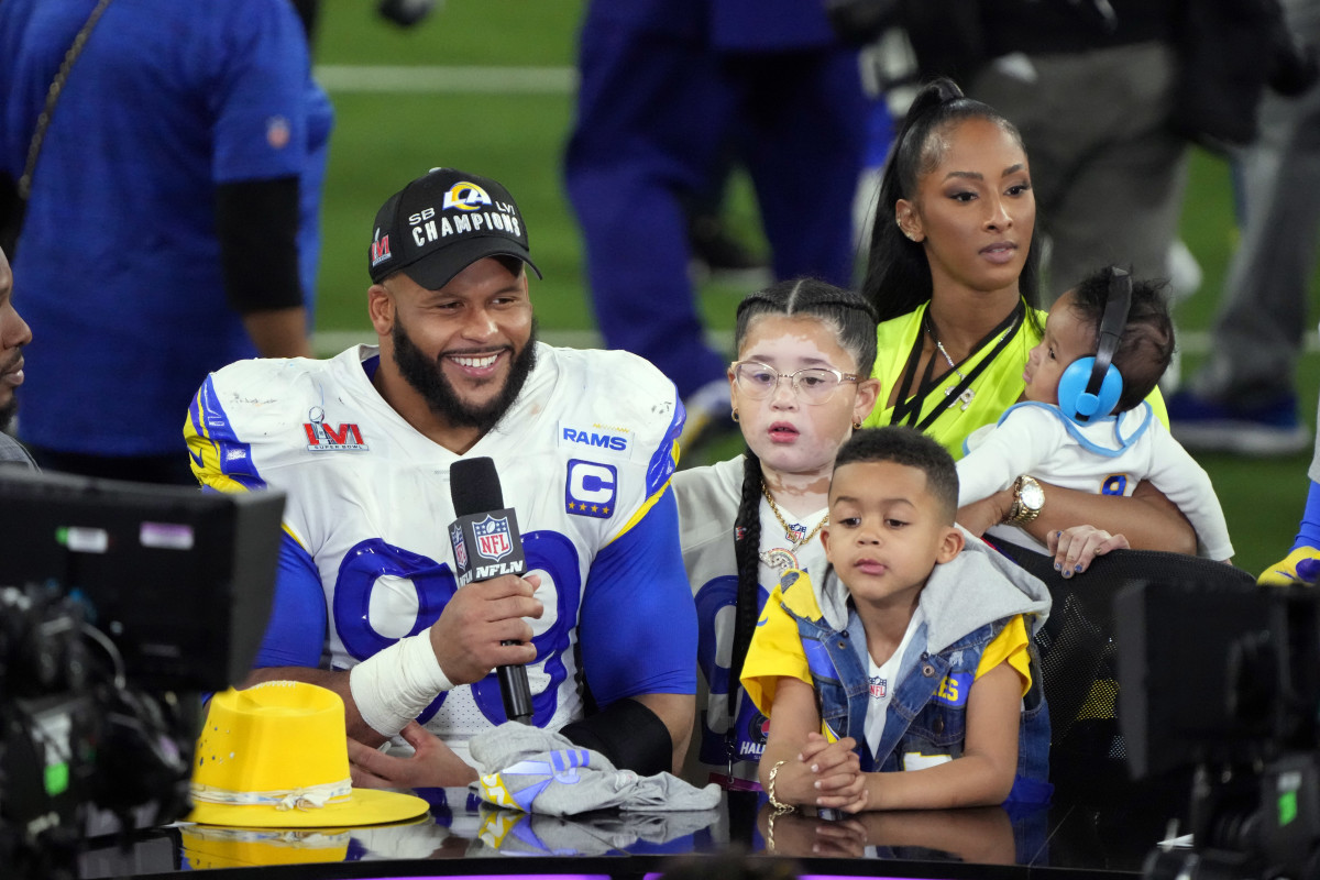 Feb 13, 2022; Inglewood, California, USA; Los Angeles Rams defensive end Aaron Donald (99) is interviewed with his wife Erica Donald and children Jaeda, Aaron Jr., and Aaric, after defeating the Cincinnati Bengals in Super Bowl LVI at SoFi Stadium. Mandatory Credit: Kirby Lee-USA TODAY Sports