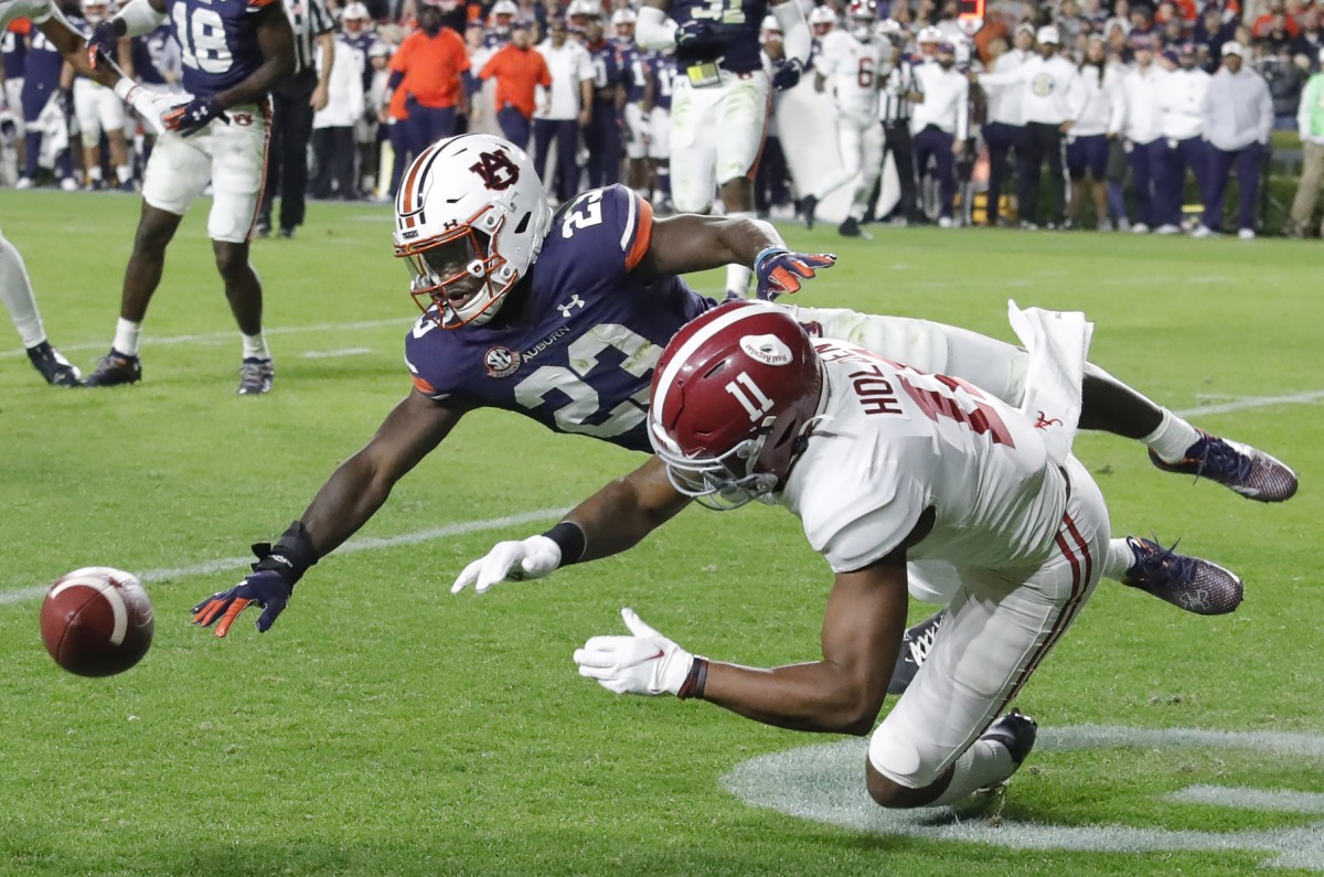Auburn cornerback Roger McCreary breaks up a pass intended for Alabama wide receiver