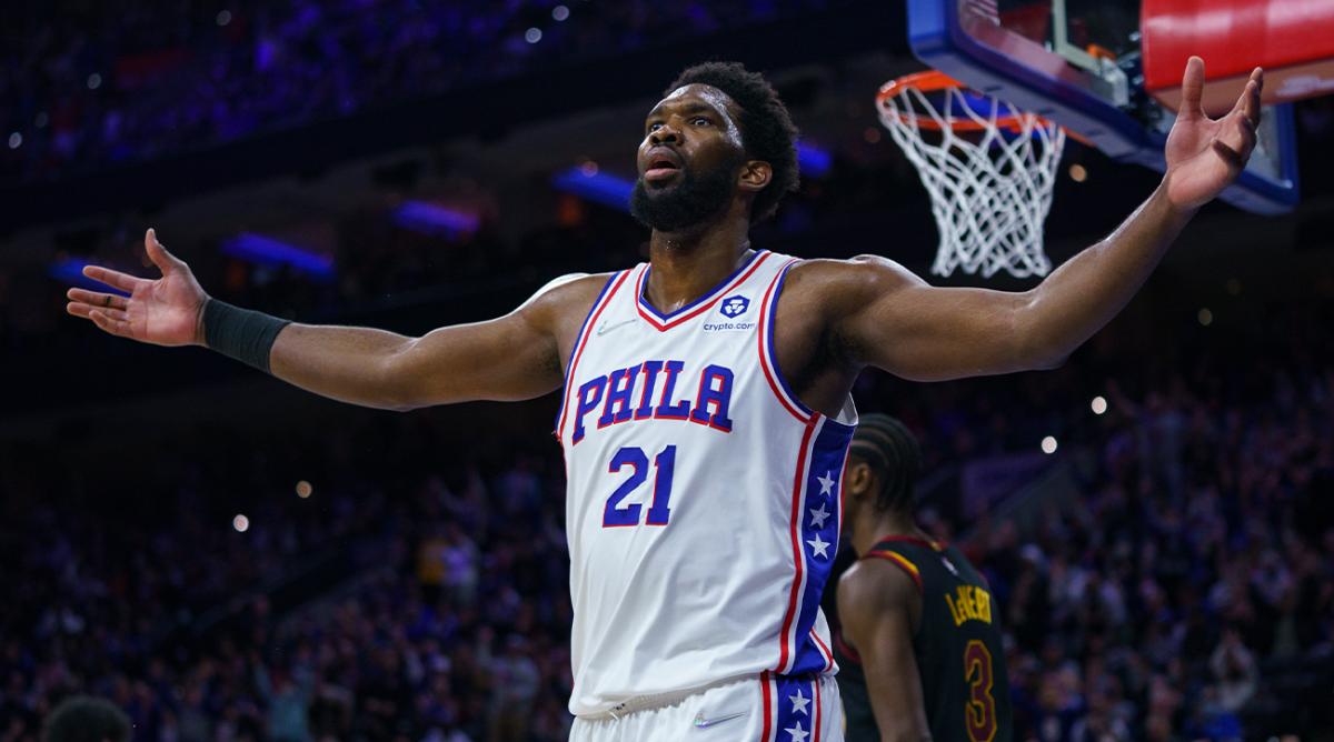 Philadelphia 76ers' Joel Embiid reacts after dunking and getting fouled during the second half of an NBA basketball game against the Cleveland Cavaliers, Saturday, Feb. 12, 2022, in Philadelphia.