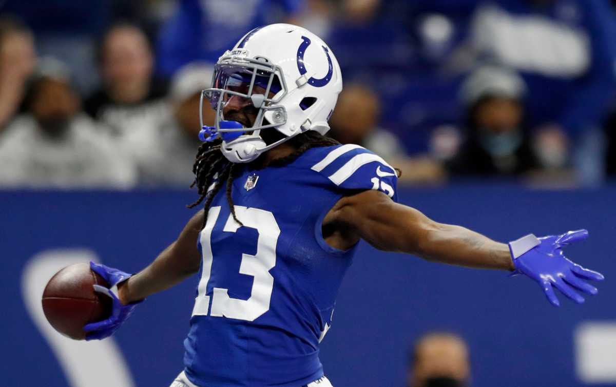 Indianapolis Colts wide receiver T.Y. Hilton (13) celebrates after catching the ball for a touchdown after it's juggled by Indianapolis Colts wide receiver Ashton Dulin (16), Las Vegas Raiders free safety Tre'von Moehrig (25) and Las Vegas Raiders cornerback Casey Hayward Jr. (29) on Sunday, Jan. 2, 2022, during a game against the Las Vegas Raiders at Lucas Oil Stadium in Indianapolis.