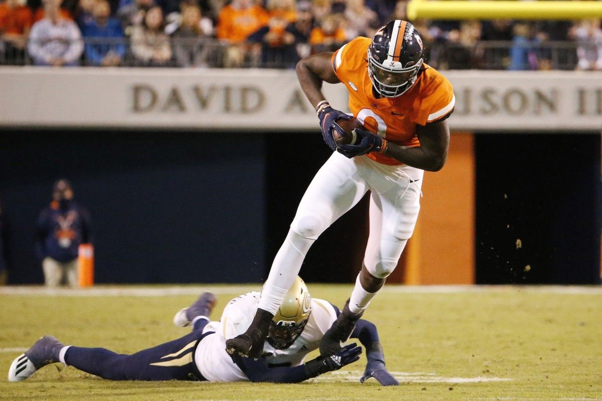 Virginia Cavaliers tight end Jelani Woods (0) runs with the ball past Georgia Tech Yellow Jackets defensive back Tariq Carpenter (2) during the third quarter at Scott Stadium.
