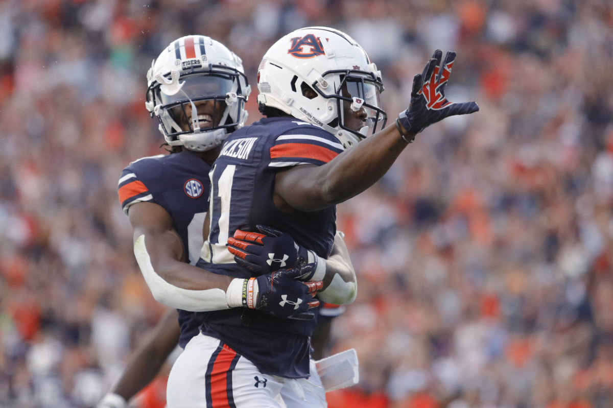 Sep 25, 2021; Auburn, Alabama, USA; Auburn Tigers receiver Shedrick Jackson (11) celebrates with receiver Ze'Vian Capers (80) after scoring a touchdown late in the fourth quarter against the Georgia State Panthers at Jordan-Hare Stadium. Mandatory Credit: John Reed-USA TODAY Sports