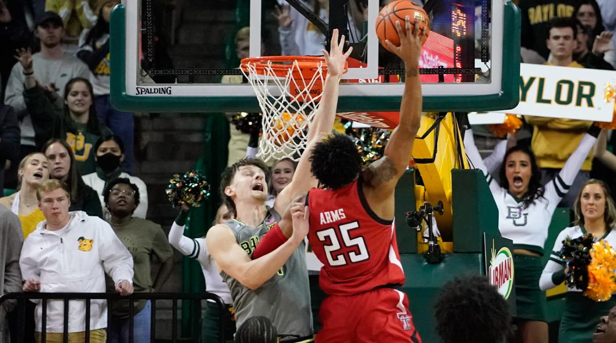 Jan 11, 2022; Waco, Texas, USA; Texas Tech Red Raiders guard Adonis Arms (25) dunks the ball over Baylor Bears guard Matthew Mayer (24) during the second half at Ferrell Center.