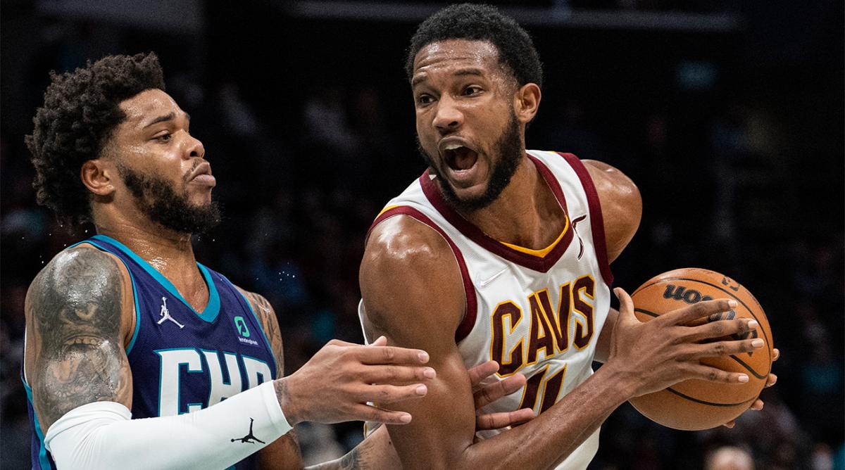 Charlotte Hornets forward Miles Bridges (0) guards Cleveland Cavaliers center Evan Mobley (4) during the second half of an NBA basketball game in Charlotte, N.C., Friday, Feb. 4, 2022.