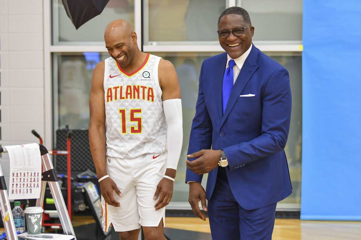 Sep 30, 2019; Atlanta, GA, USA; Atlanta Hawks player Vince Carter (15) shares a laugh with former Hawks player Dominique Wilkins during media day at Emory Healthcare Courts.