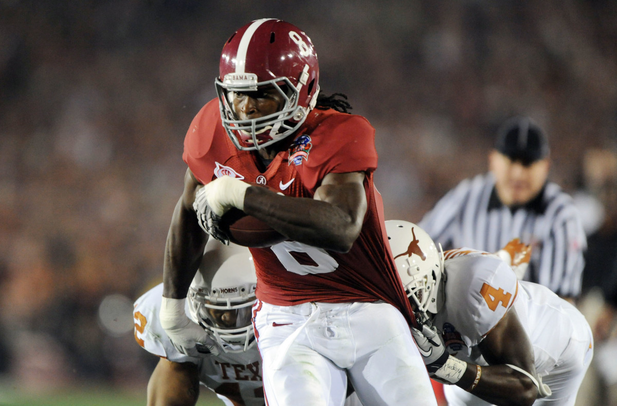 Alabama Crimson Tide wide receiver Julio Jones (8) runs past Texas Longhorns cornerback Aaron Williams (4) during the first quarter of the 2010 BCS national championship game at the Rose Bowl.