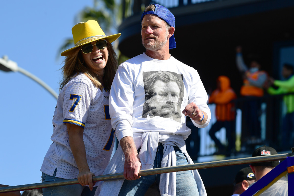 Feb 16, 2022; Los Angeles, CA, USA; Los Angeles Rams general manager Les Snead and wife Kara Henderson celebrate during the championship victory parade. Mandatory Credit: Gary A. Vasquez-USA TODAY Sports