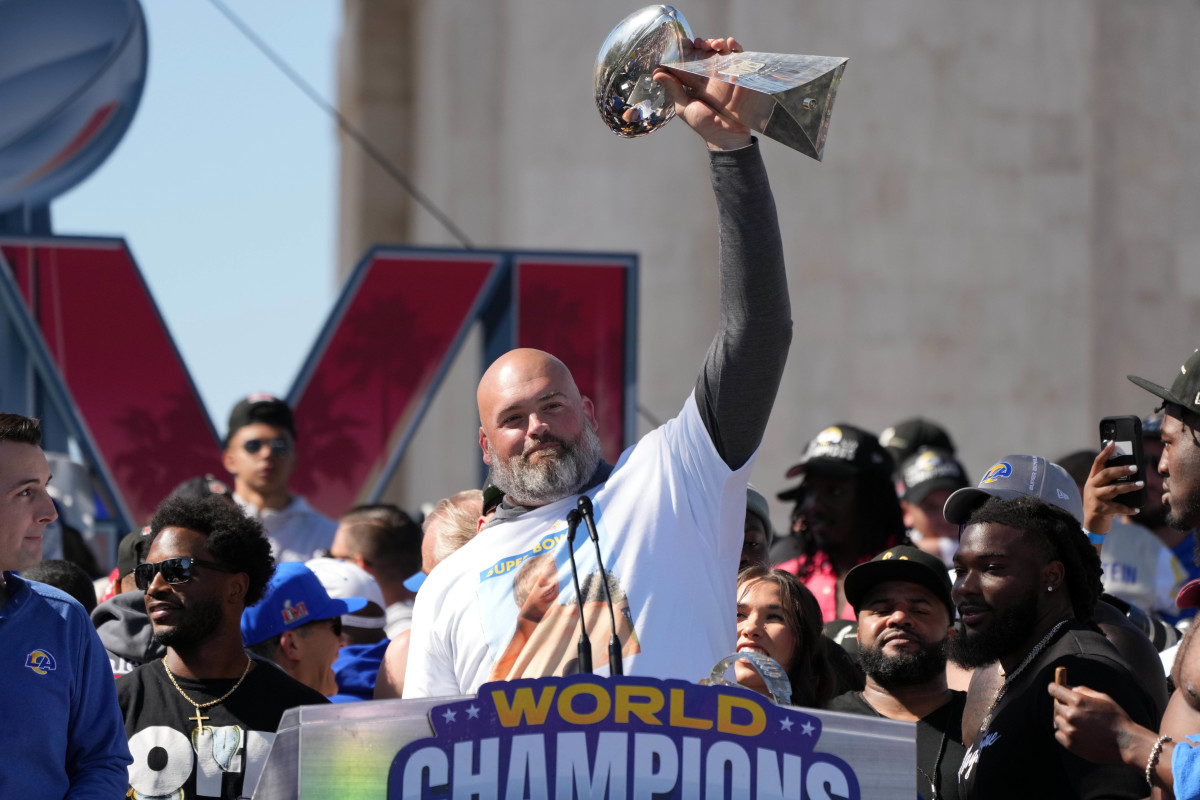 Feb 16, 2022; Los Angeles, CA, USA; Los Angeles Rams tackle Andrew Whitworth holds the Vince Lombardi trophy during the Super Bowl LVI championship rally at the Los Angeles Memorial Coliseum. Mandatory Credit: Kirby Lee-USA TODAY Sports