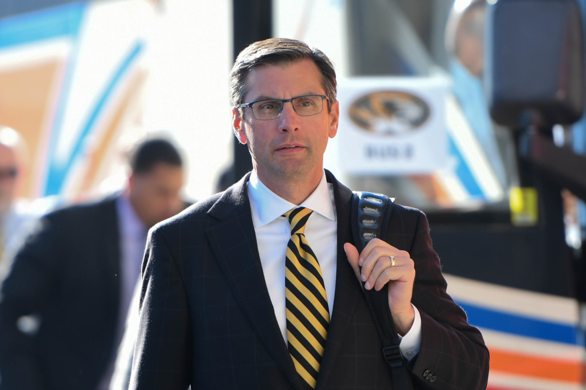 Missouri Tigers offensive coordinator Derek Dooley gets off of the team bus before the game against the Tennessee Volunteers at Neyland Stadium.