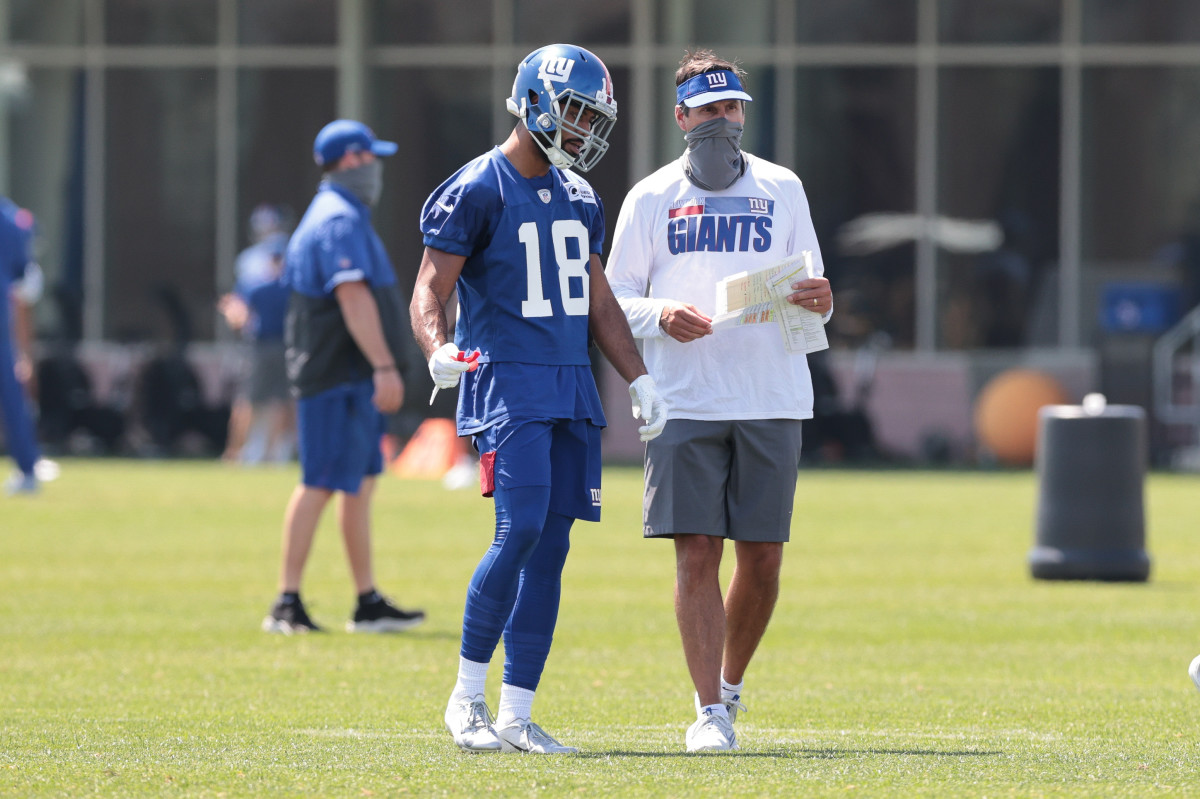 New York Giants wide receiver C.J. Board (18) talks offensive assistant coach Derek Dooley with during training camp at Quest Diagnostics Training Center.