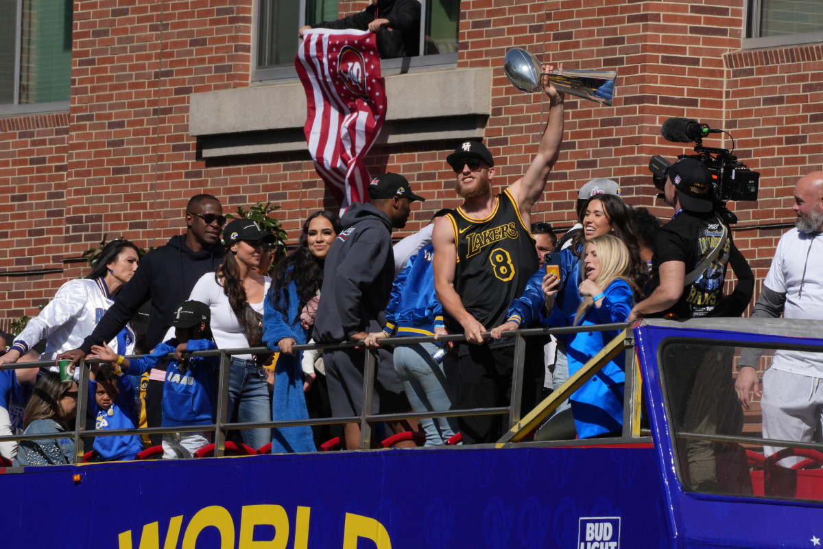 Feb 16, 2022; Los Angeles, CA, USA; Los Angeles Rams receiver Cooper Kupp holds the Vince Lombardi trophy during Super Bowl LVI championship parade. Mandatory Credit: Kirby Lee-USA TODAY Sports