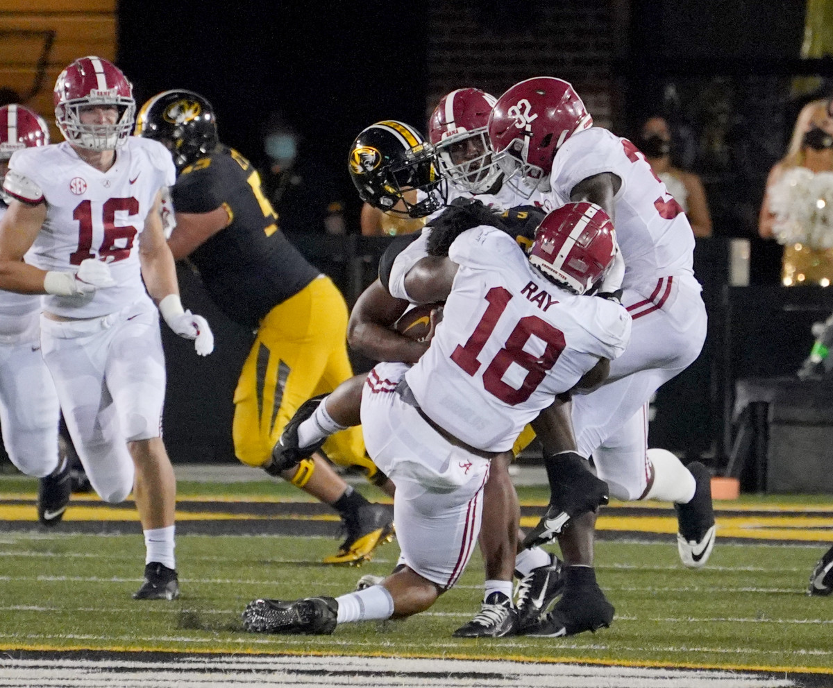 Missouri Tigers quarterback Shawn Robinson (3) looses his helmet as he is sacked by Alabama Crimson Tide defensive lineman LaBryan Ray (18) during the second half at Faurot Field at Memorial Stadium.