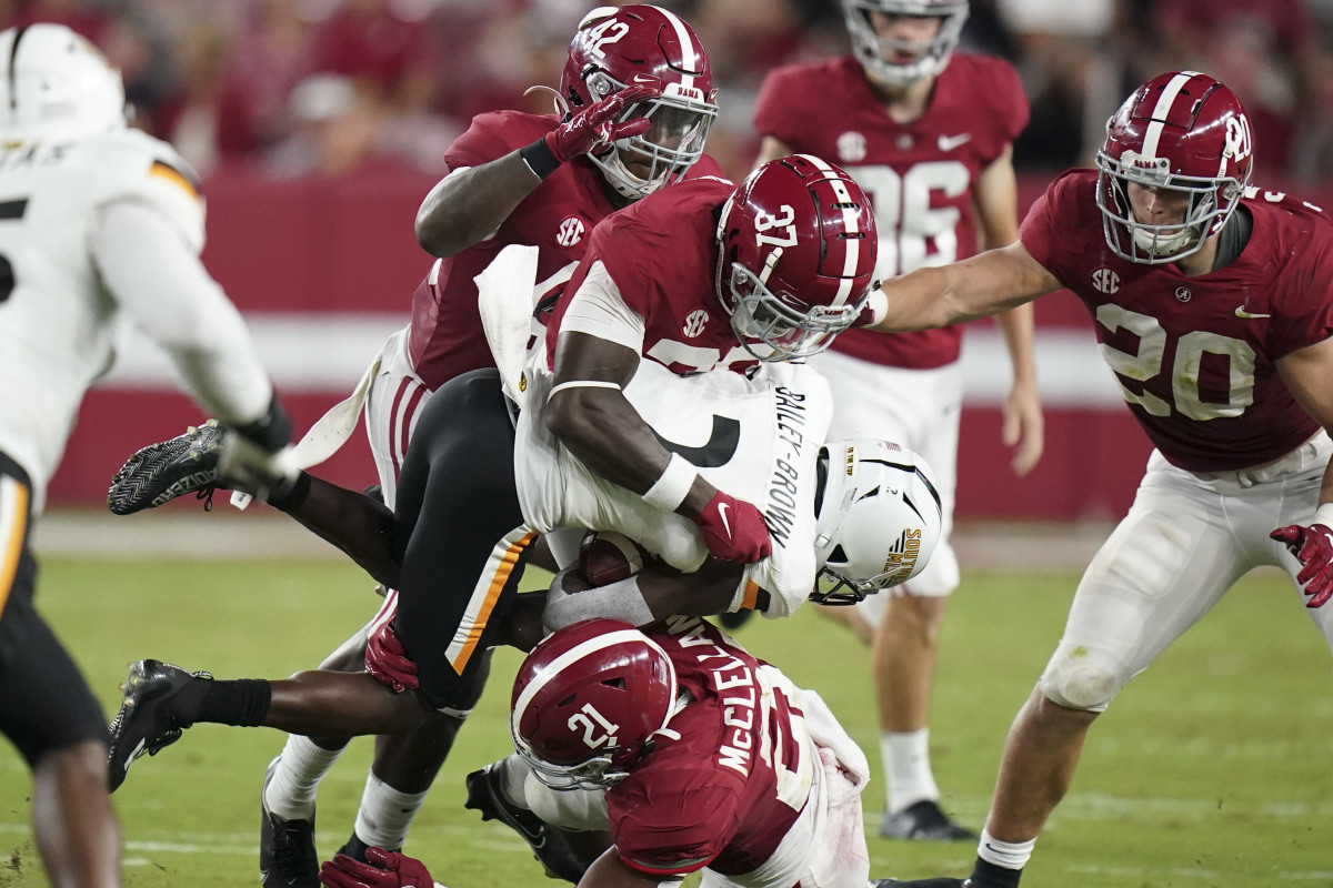 Alabama Crimson Tide linebacker Demouy Kennedy (37) and Alabama Crimson Tide defensive back Brylan Lanier (21) wrap up Southern Miss Golden Eagles wide receiver Da'quan Bailey-Brown (2) at Bryant-Denny Stadium.