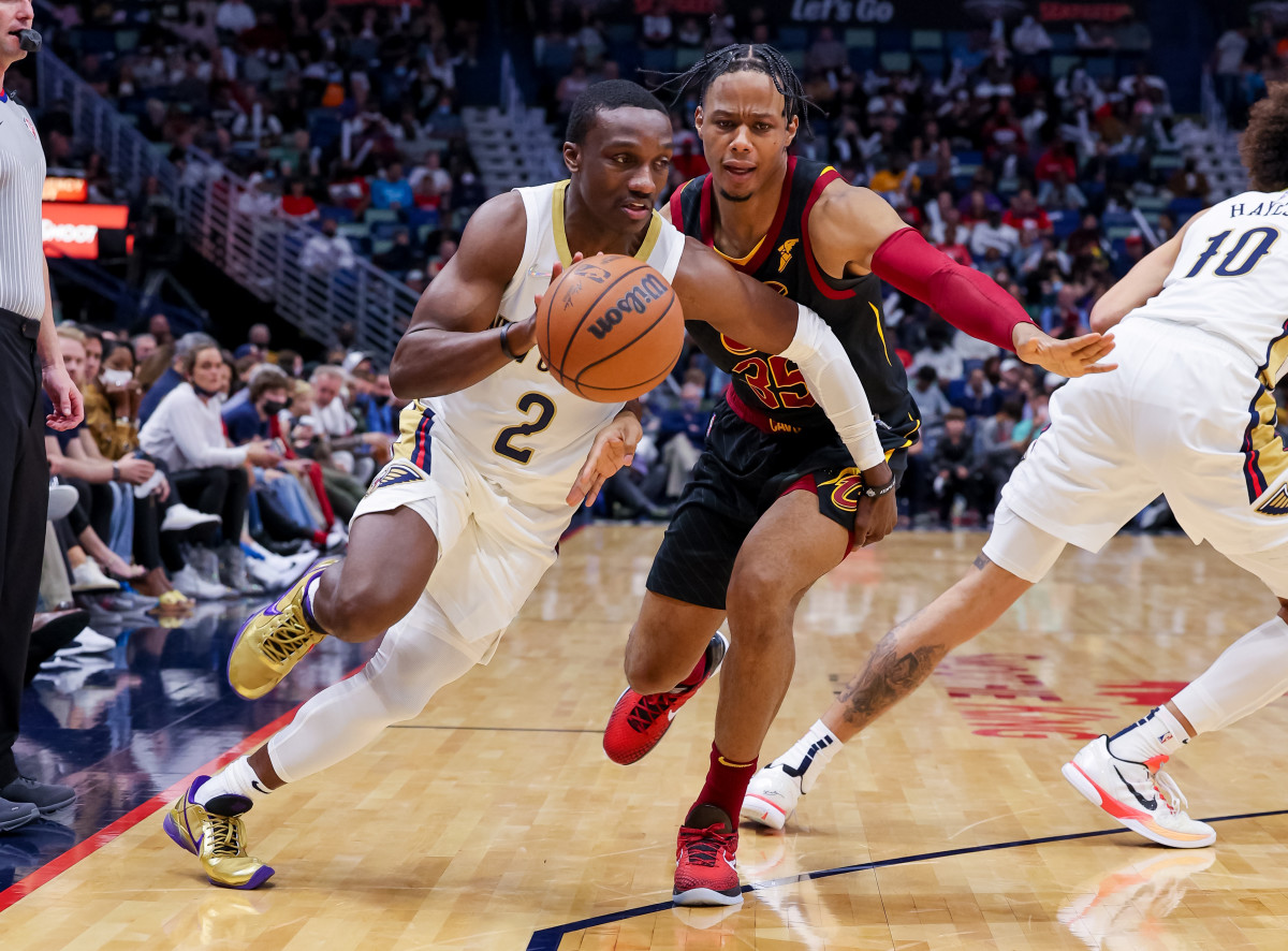 Dec 28, 2021; New Orleans, Louisiana, USA; New Orleans Pelicans guard Jared Harper (2) dribbles around Cleveland Cavaliers forward Isaac Okoro (35) during the second half at Smoothie King Center. Mandatory Credit: Stephen Lew-USA TODAY Sports
