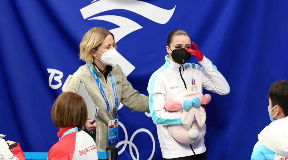 Kamila Valieva holding a stuffed rabbit after her free skate.