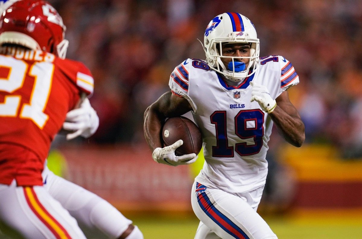 Buffalo Bills wide receiver Isaiah McKenzie (19) runs the ball as Kansas City Chiefs cornerback Mike Hughes (21) defends during the first half in a AFC Divisional playoff football game at GEHA Field at Arrowhead Stadium.