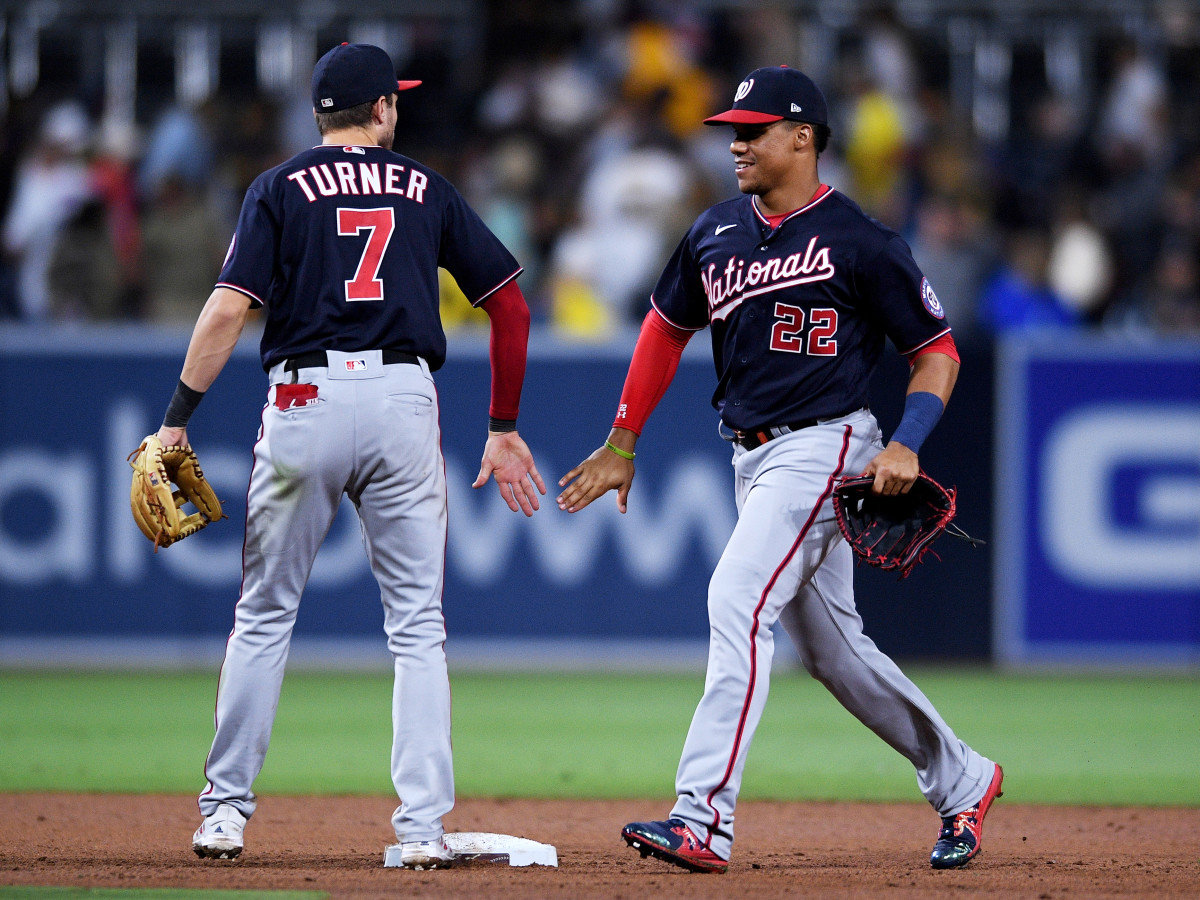 Jul 5, 2021; San Diego, California, USA; Washington Nationals shortstop Trea Turner (7) and right fielder Juan Soto (22) celebrate on the field after defeating the San Diego Padres at Petco Park.