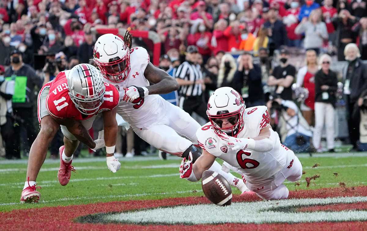 Utah Utes safety Cole Bishop (6) jumps on a fumble by Ohio State Buckeyes wide receiver Jaxon Smith-Njigba (11) during the second quarter of the Rose Bowl in Pasadena, Calif. on Jan. 1, 2022. College Football Rose Bowl.