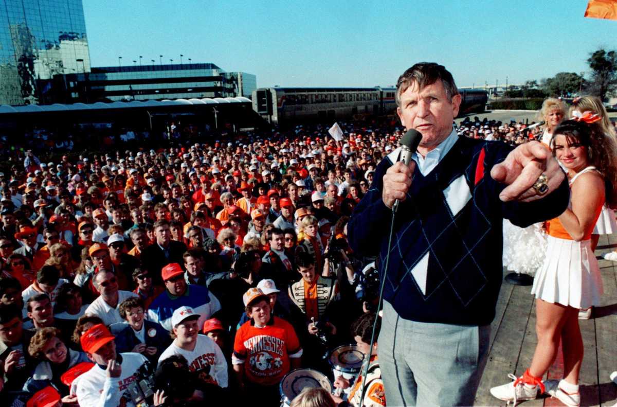 Tennessee head coach Johnny Majors, front right, talks to fans during a pep rally at Union Stadium in Dallas on Dec. 31, 1989, a warm-up for their Cotton Bowl game against Arkansas. Title 1990 Cotton.