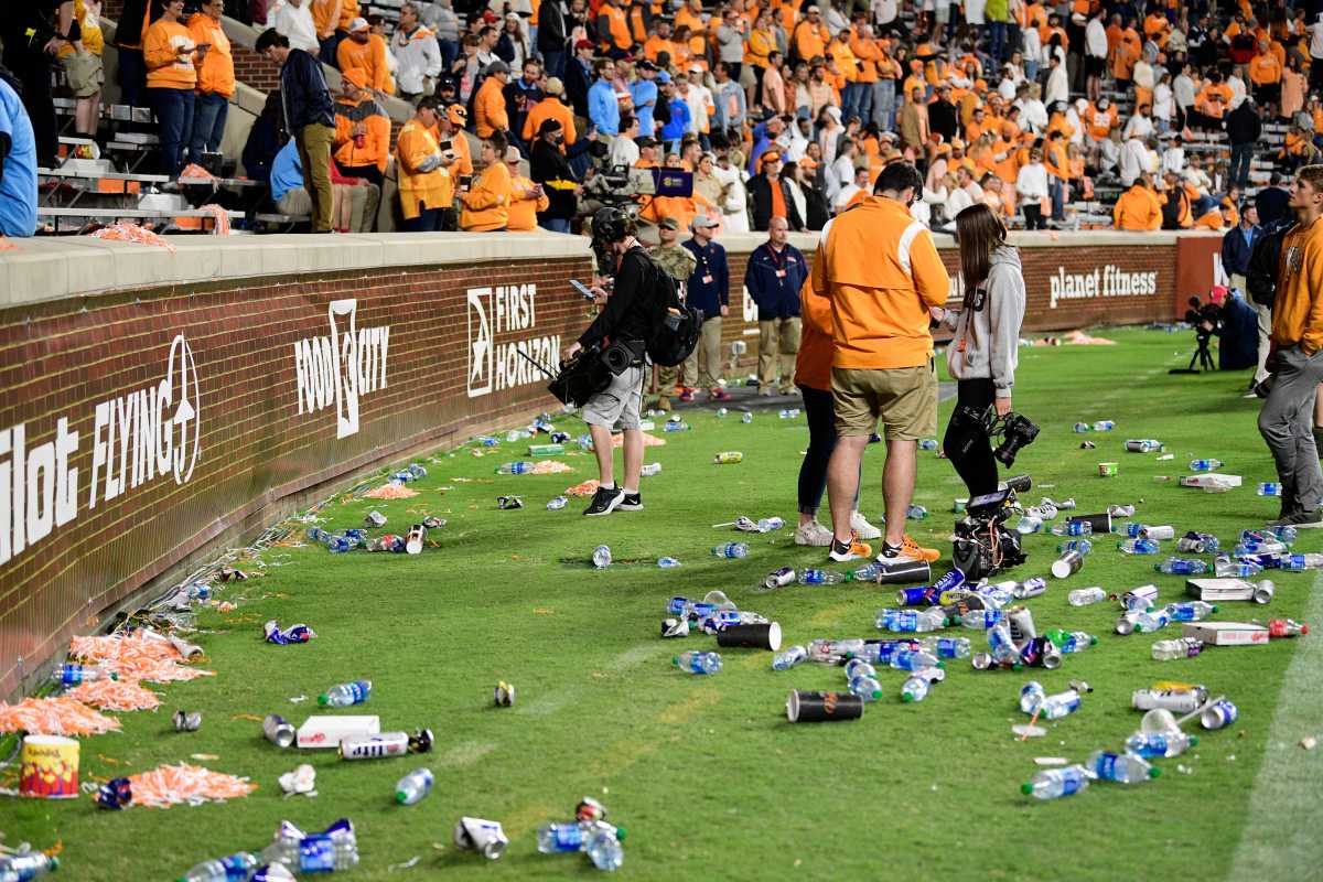 Trash litters the sidelines after it was ruled that Jacob Warren was a yard short of the first down marker on a 4th and 24 play during an SEC football game between Tennessee and Ole Miss at Neyland Stadium in Knoxville, Tenn. on Saturday, Oct. 16, 2021. Tennessee fans littered the Neyland Stadium field with debris for several minutes following Ole Miss' game-clinching defensive stop with 54 seconds to play.