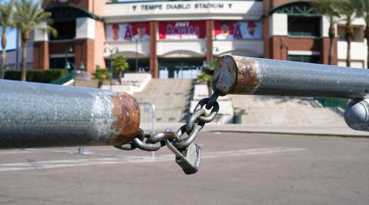 The main parking lot at the Los Angeles Angels Tempe Diablo Stadium remains closed as pitchers and catchers are not starting spring training workouts as scheduled as the Major League Baseball lockout enters its 77th day and will prevent pitchers and catchers from taking the field for the first time since October in Tempe, Ariz., Wednesday, Feb. 16, 2022.