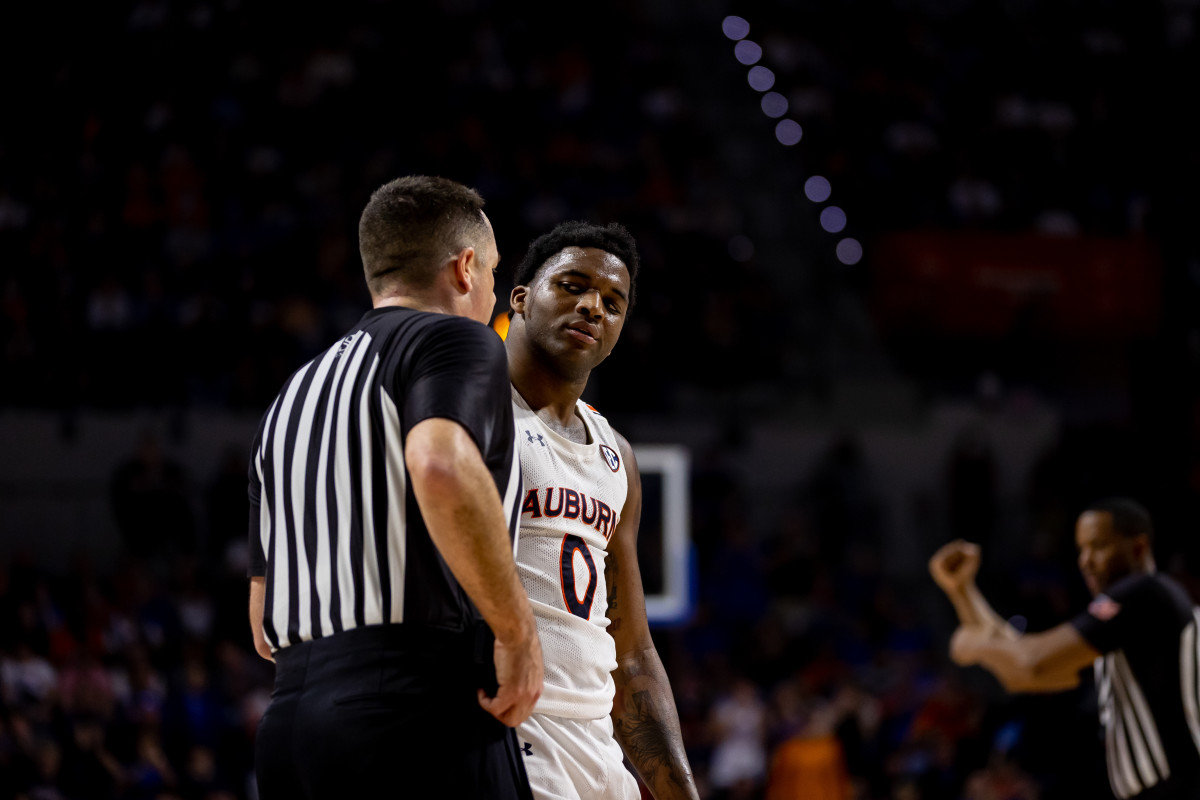 Feb 19, 2022; Gainesville, Florida, USA; Auburn Tigers guard K.D. Johnson (0) argues with a referee during the second half against the Florida Gators at Billy Donovan Court at Exactech Arena. Mandatory Credit: Matt Pendleton-USA TODAY Sports