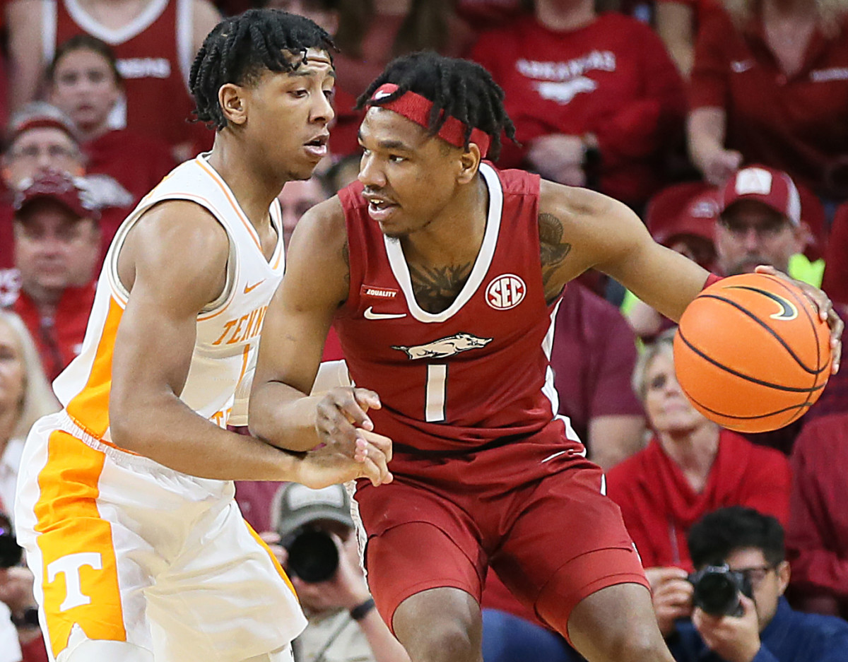 Arkansas Razorbacks guard JD Notae (1) drives against Tennessee Volunteers guard Kennedy Chandler (1) in the first half at Bud Walton Arena.