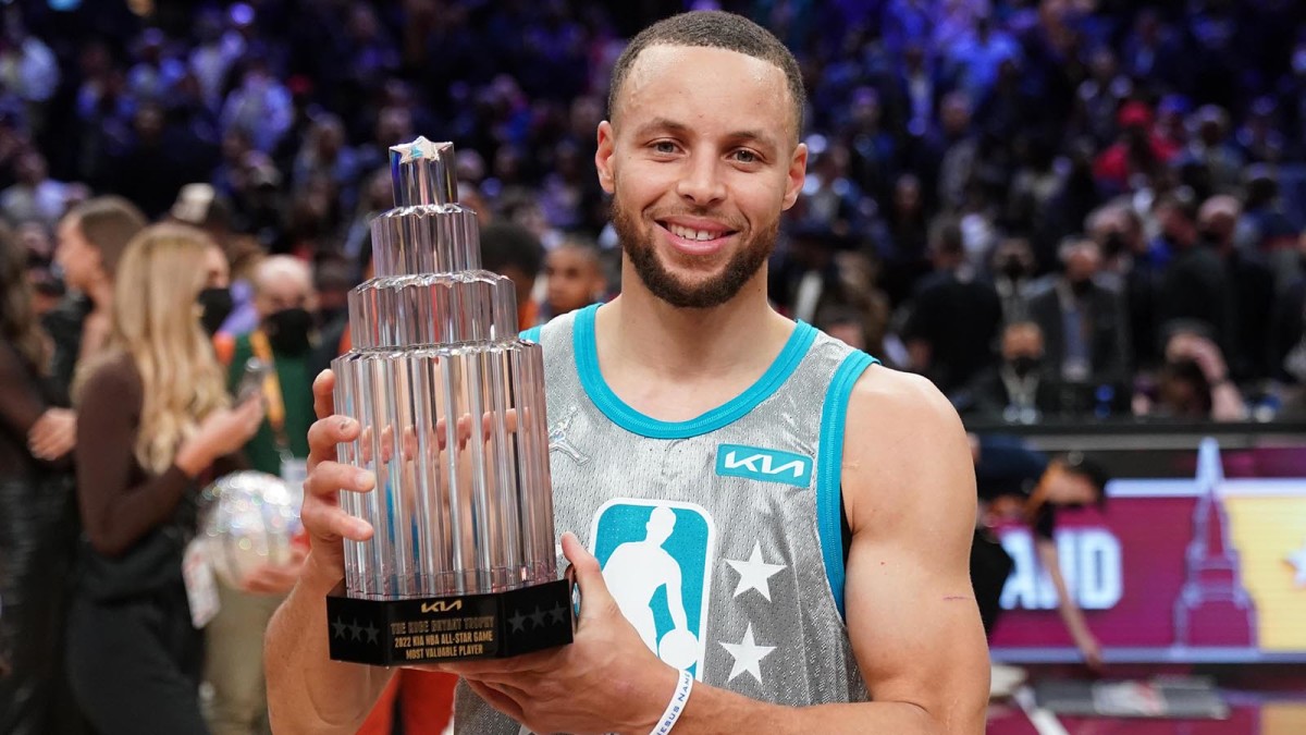 Team LeBron guard Stephen Curry (30) holds the Kobe Bryant Trophy after the 2022 NBA All-Star Game.