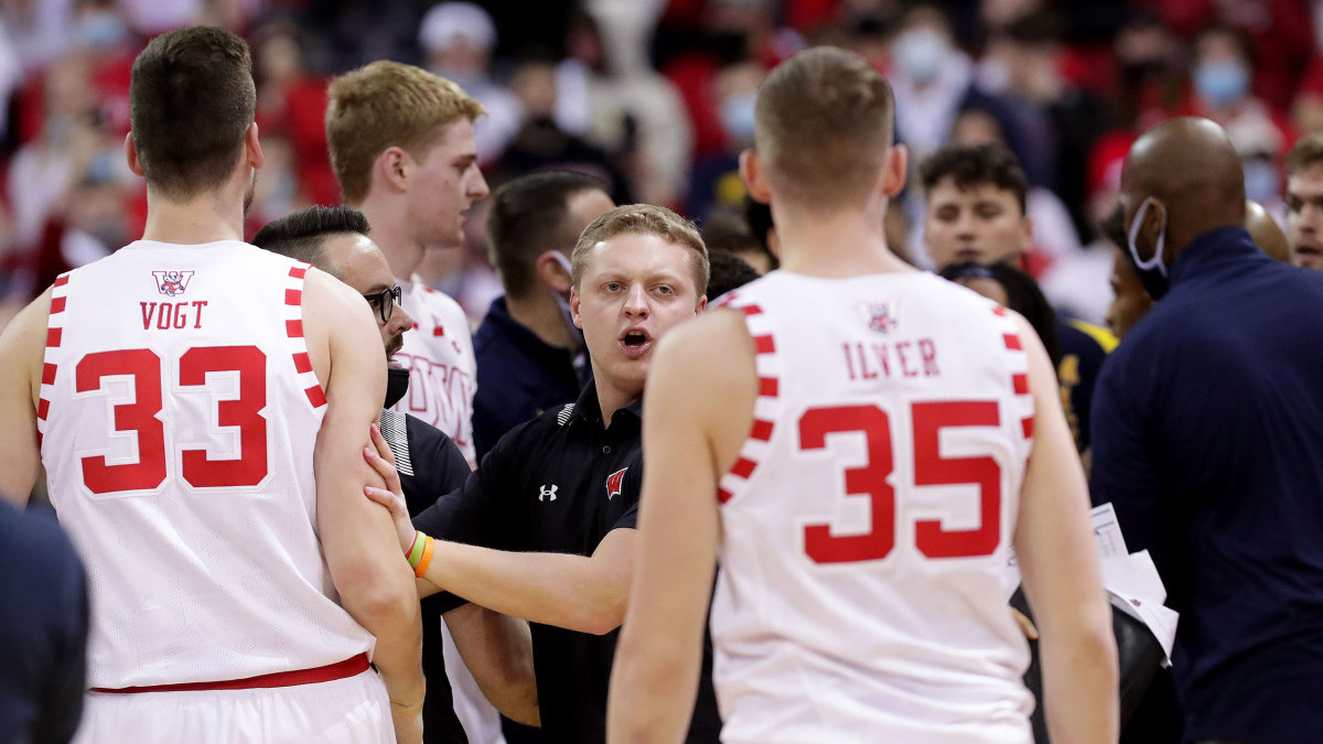Wisconsin and Michigan players get into a scuffle