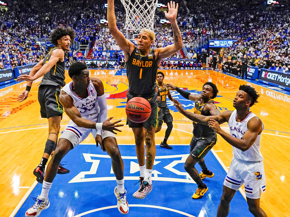 Kansas guard Jalen Coleman-Lands (55) passes to forward K.J. Adams (24) against Baylor