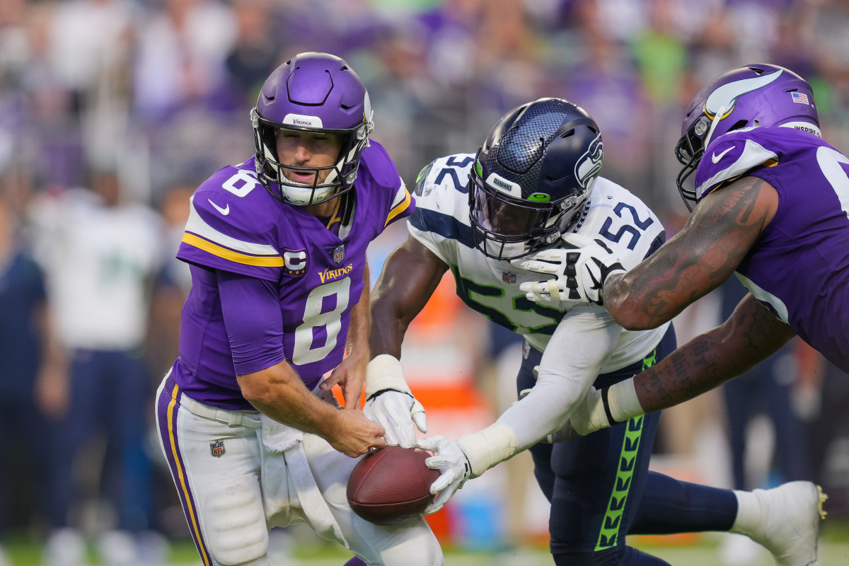 NFL: Seattle Seahawks at Minnesota Vikings Sep 26, 2021; Minneapolis, Minnesota, USA; Seattle Seahawks defensive end Darrell Taylor (52) strips Minnesota Vikings quarterback Kirk Cousins (8) in the third quarter at U.S. Bank Stadium.