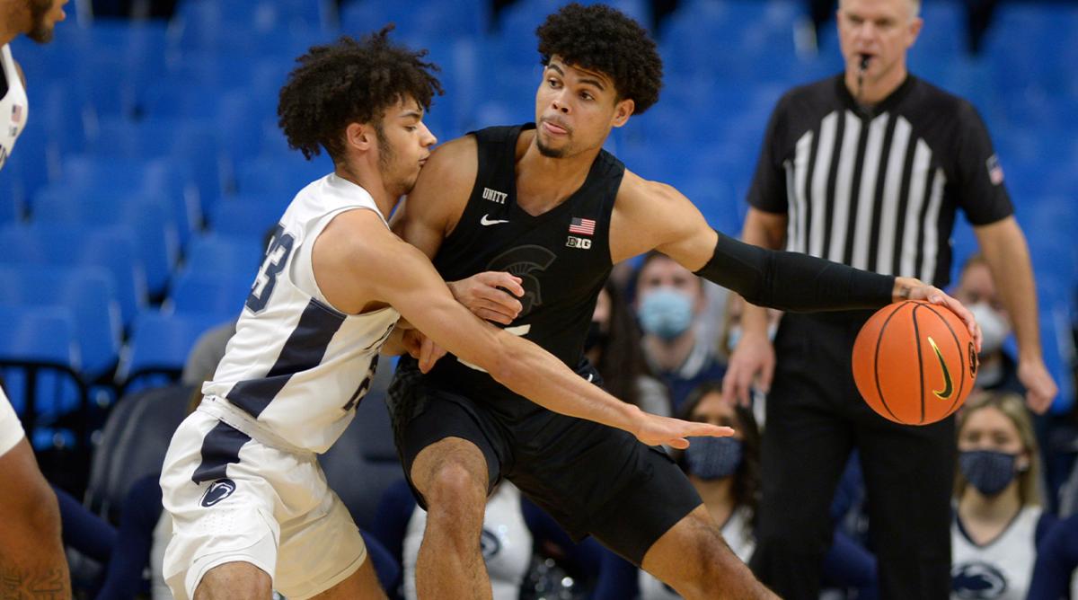 Michigan State's Malik Hall, right, works against Penn State's Dallion Johnson (23) during the first half of an NCAA college basketball game Tuesday , Feb. 15, 2022, in State College, Pa.