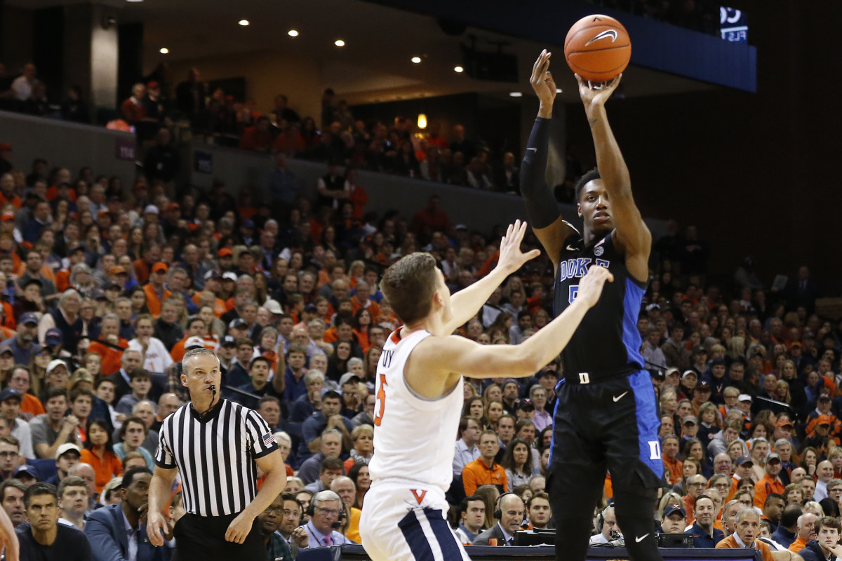 RJ Barrett attempts a three-pointer over Kyle Guy during the Duke Blue Devils at Virginia Cavaliers men's basketball game.